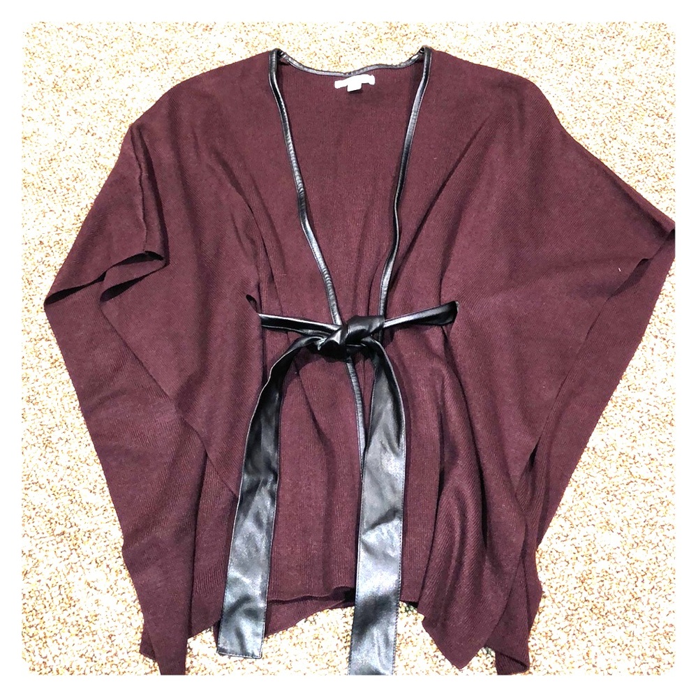 Wrap poncho with leather like belt and trim